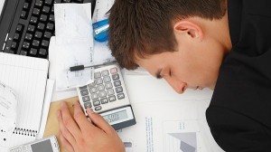 Top view of a business man sleeping on desk